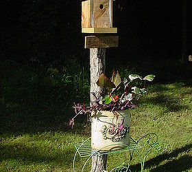 honored to host our first home garden tour this spring, flowers, gardening, outdoor living, My husband made the birdhouse from pallet wood The planter is a decorative waste can another thrift store find