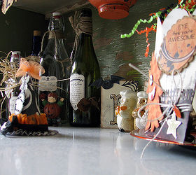 frugal fall decorating, crafts, flowers, repurposing upcycling, seasonal holiday decor, Recycled bottles that I added spooky labels to