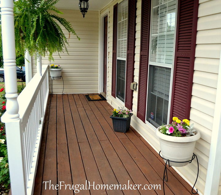 front porch makeover, decks, flowers, home decor, porches, Stained the deck and added some flowers in pots