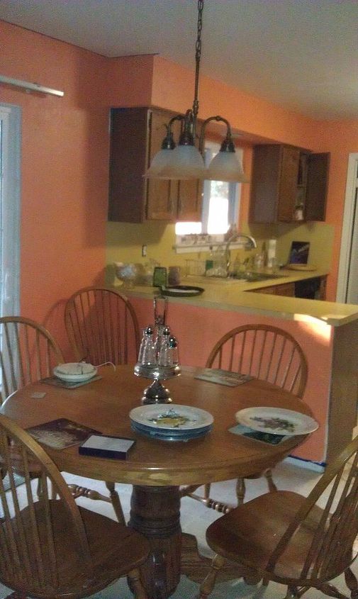 q bright orange walls in breakfast room, home decor, kitchen design, painting, Breakfast room looking into kitchen Yes replacing those icky countertops