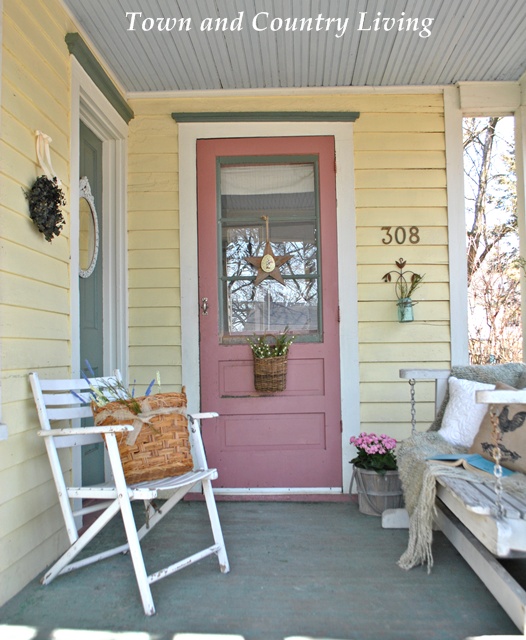 sprucing up a farmhouse porch, outdoor living, porches, An old porch swing and shabby white chair provide outdoor seating