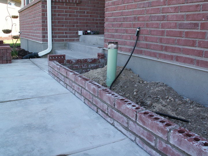 q new brick planter, concrete masonry, landscape, its just a short planter the cap will create one more course high