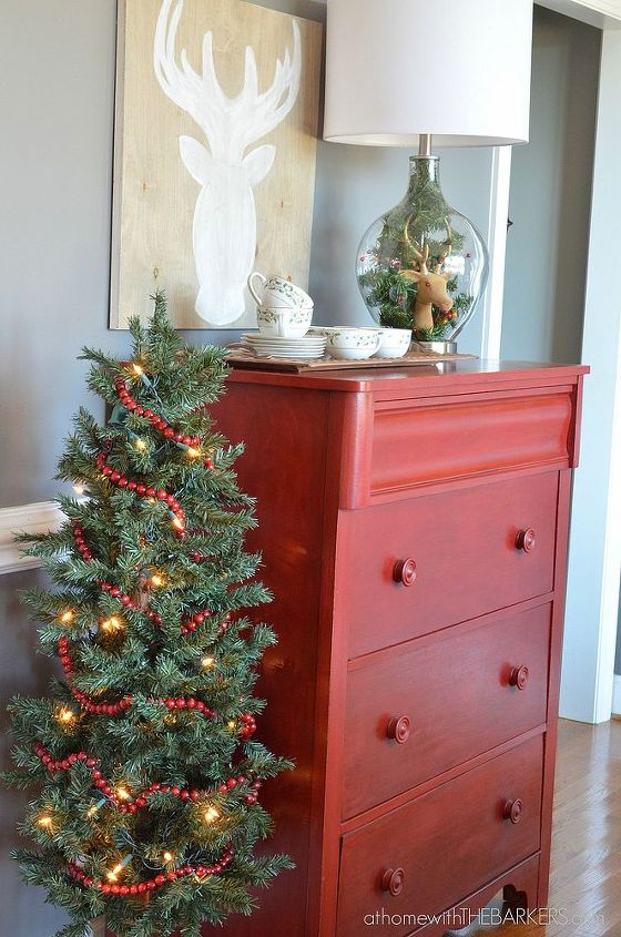 christmas home tour, christmas decorations, dining room ideas, seasonal holiday decor, Love how the red chest of drawers looks great with my red berry garland