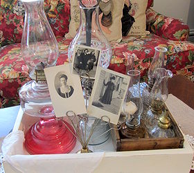decorating with collections oil lamps, home decor, Photographs of vintage aunts and a old curling iron complete the display