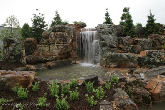 world s most extreme ecosystem fish pond construction by certified aquascape, go green, outdoor living, patio, ponds water features, Finished Aquascape Ecosystem Fish Pond Waterfall Pond Behind these Waterfalls is a Cave Constructed by the largest group of professional Pond Builders in the World Certified Aquascape Contractors