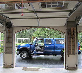 garage organization for a family of 10, garages, organizing, shelving ideas, storage ideas, Even the space between the doors is pressed into service giving the tiki torches a place to live
