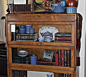 double duty furniture pieces maximize storage, painted furniture, A vintage lawyers stacked bookcase holds a special book and a china collection The glass front keeps out the dust and dirt