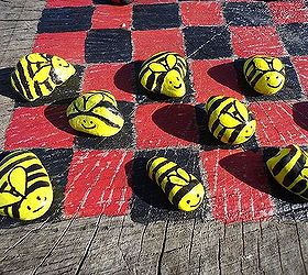 anyone for a game of checkers, outdoor living, I decided to paint rocks for game pieces Bumblebees were one set