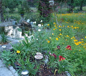 i garden with plants for wildlife and butterflies and native species that will thrive, flowers, gardening, outdoor living, ponds water features, note the cup made with copper pipe and a pretty cup and saucer