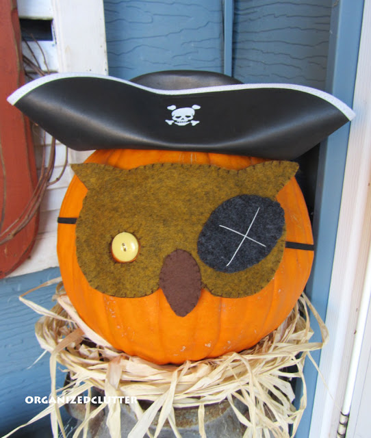 felt hand stitched pumpkin masks, seasonal holiday decor, A Dollar Tree Pirate hat with the pirate owl mask