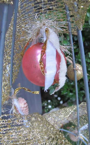 re purposing a tomato cage into a christmas tree, christmas decorations, repurposing upcycling, seasonal holiday decor, I had one vintage pink ball so I dangled it with thread from the top inside the wires