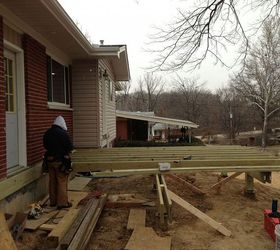 how we re making mom s remodel dreams come true, countertops, flooring, home improvement, kitchen backsplash, kitchen cabinets, kitchen design, tile flooring, February 2013 The bump out is complete and the deck portion is underway Snow is just beginning to fall in this photo