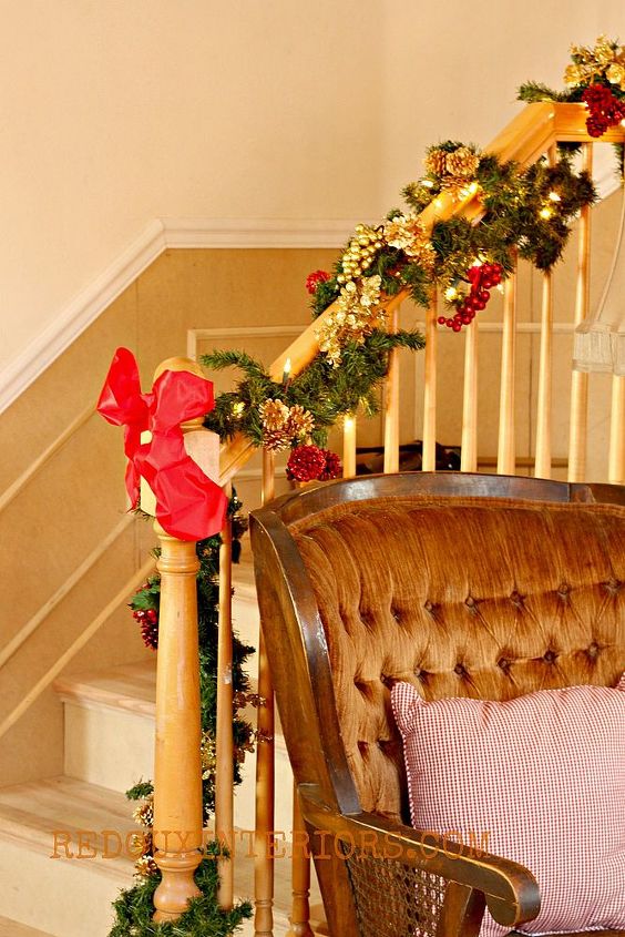 keeping it real holiday home tour, christmas decorations, seasonal holiday decor, Stairs were recently replaced and trim added The painting has yet to happen Chair needs upholstery work Feeling at home now Love my festive garland though