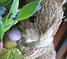 rabbit burrow spring wreath, crafts, easter decorations, seasonal holiday decor, wreaths, This little guy is holding some Easter Eggs the touch is so minimal that you could leave the wreath out even pass Easter making it perfect for the whole Spring Season