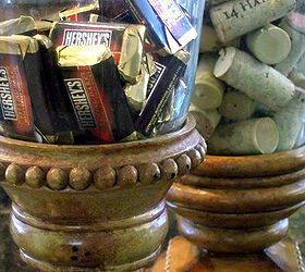 before you throw away those leftover jars let me show you several simple ways to, home decor, repurposing upcycling, bell jars serving as a candy dish and a place to hold my growing collection of wine corks