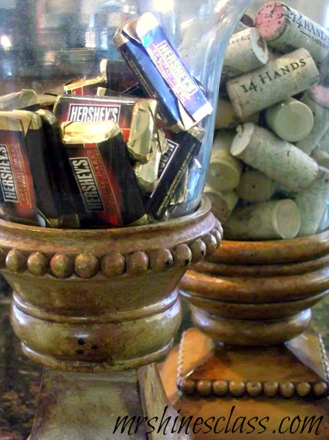 before you throw away those leftover jars let me show you several simple ways to, home decor, repurposing upcycling, bell jars serving as a candy dish and a place to hold my growing collection of wine corks