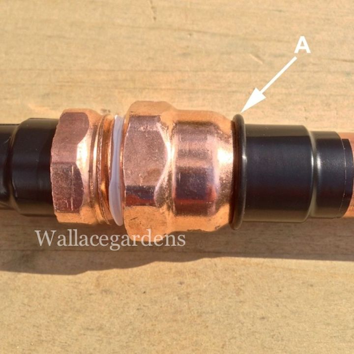 wine bottle watering device with copper tubing for container gardens