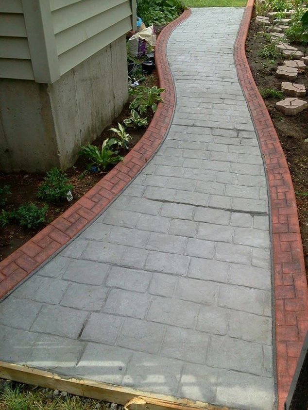 cobblestone walkway in my side yard, concrete masonry, curb appeal, gardening, I had the border on the side of the house make out of extruded concrete and stamped to look like brick and the walkway poured concrete stamped like cobblestone