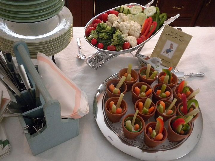 book inspired buffet baby, home decor, The Tale of Peter Rabbit was placed with the veggie tray Veggie shooters made with DOllar Tree clay pots lined with plastic shot glasses and planted with ranch dip celery carrots peppers Mariposa s wheelbarrow with more