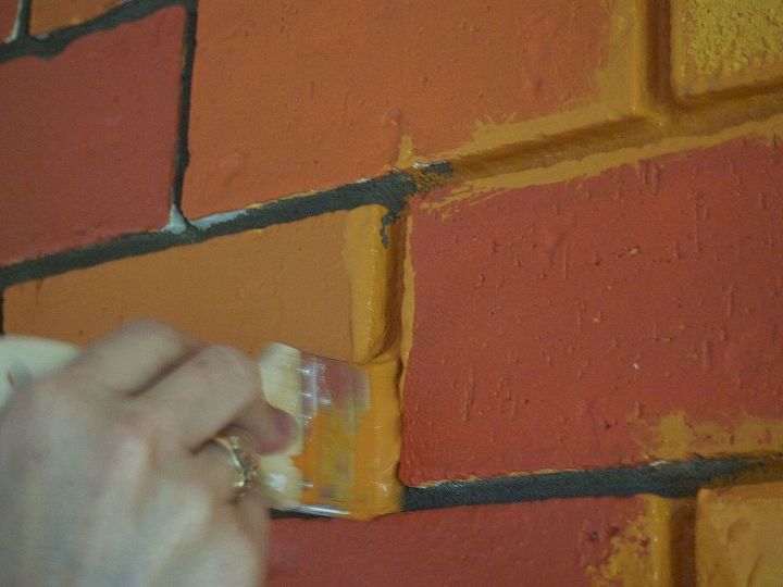 would you paint your brick fireplace a bold orange we did, fireplaces mantels, home decor, living room ideas, painting, We recommend a cheap brush for painting the mortar You ve got to really smush the paint in