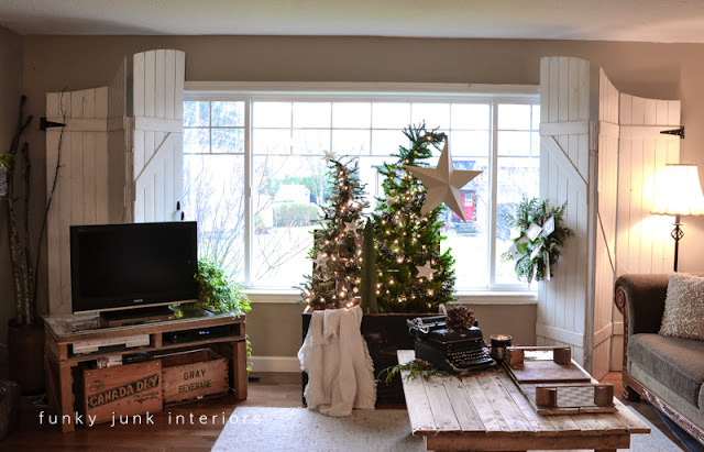 a christmas tree forest in a crate, seasonal holiday d cor, The Christmas tree forest uses little real estate and brings a lovely focal point to the living room this year