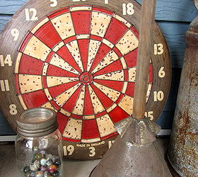 decorating the front patio with vintage collectibles, gardening, outdoor living, repurposing upcycling, Marbles laundry stompler and a vintage dart board