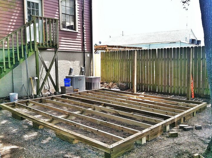 backyard deck in new orleans, 2x4s rest on top of 6x6 supports 3 inch Deck screws connect all framing