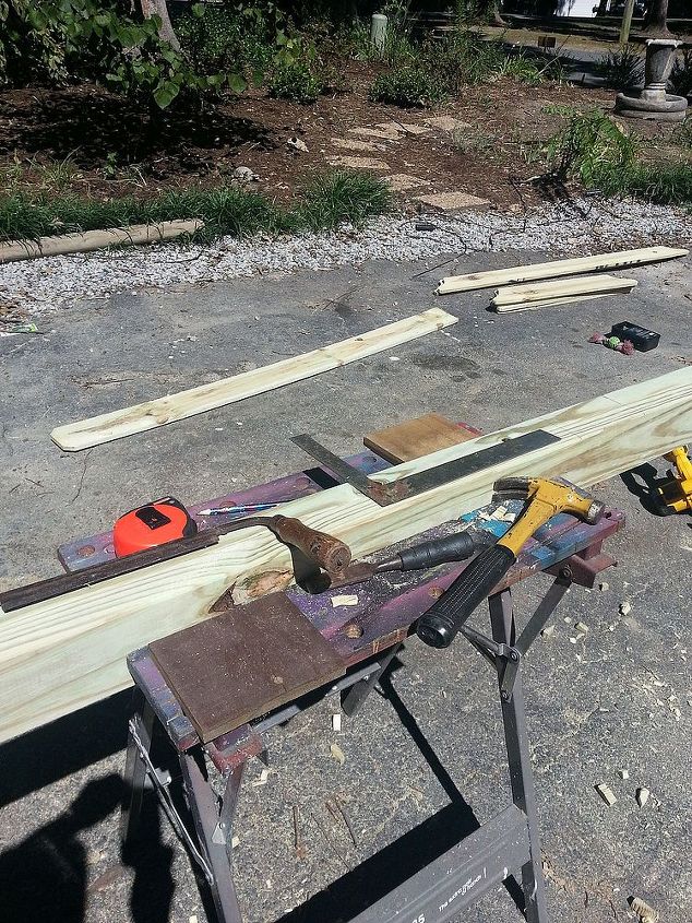 instructions for pergola for under 20, diy, outdoor living, woodworking projects, After cutting all 4 2x4s 7ft in length measured where I wanted inside bracing 1x6 pickets and traced outside edges of picket to notch out where the bracing goes for a professional look