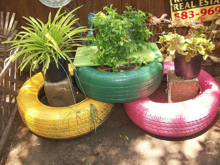 my colorful tires, gardening, repurposing upcycling, I finally had some time to spray paint old tires to add color to my back yard