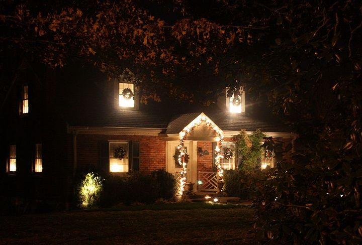 christmas curb appeal, christmas decorations, doors, seasonal holiday decor, wreaths, Glowing candles look so pretty at night