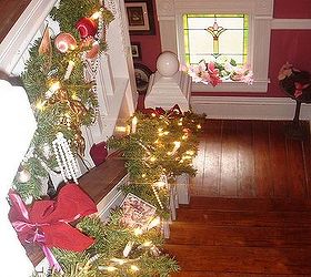 i love decorating our 1895 queen anne victorian for christmas with 12 trees, christmas decorations, seasonal holiday decor, wreaths, Front staircase garland