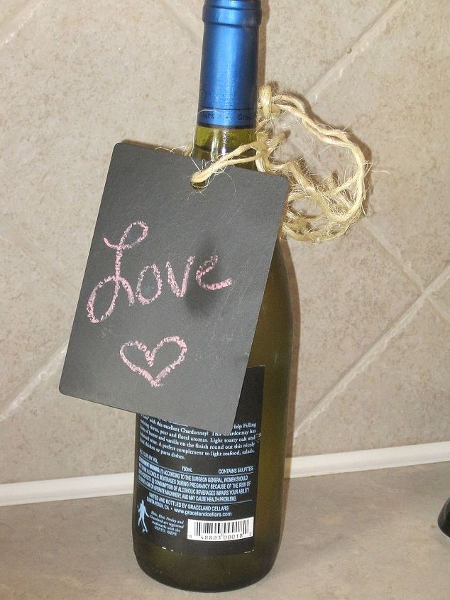 repurpose countertop samples into chalkboard tags, chalkboard paint, crafts, Then attach it with ribbon or like I did with twine around a wine bottle or like the picture above where I attached it to a pitcher of flowers The possibilities are endless