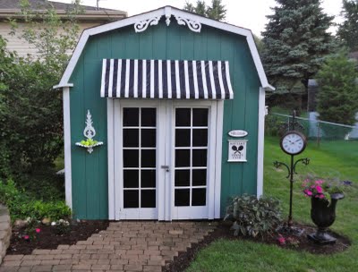 my backyard shed gets a much needed makeover, outdoor living, painting, Here is my finished product It is not a tennis club Total cost was only 40 I made the awning out of a tarp and masking tape and furring strips Such a difference for a little effort and money