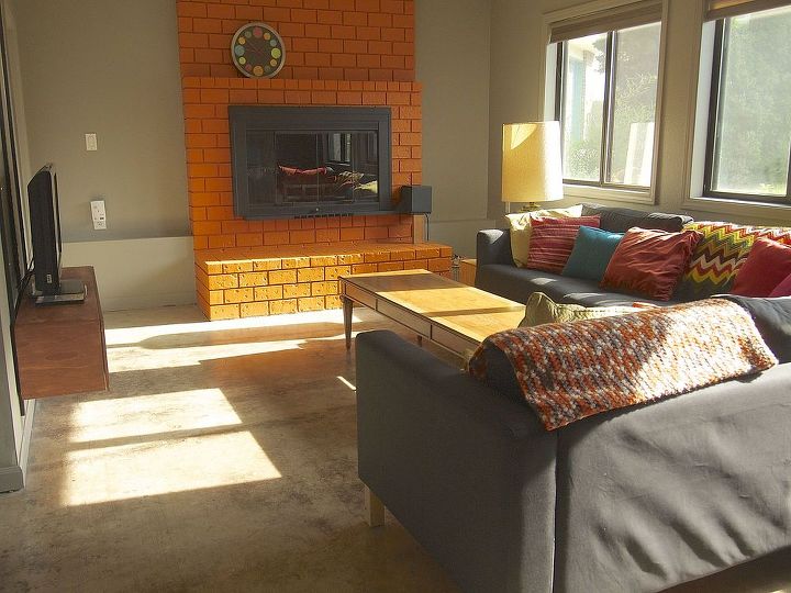 would you paint your brick fireplace a bold orange we did, fireplaces mantels, home decor, living room ideas, painting, And this is what we ve got now We love what a few cans of orange paint have done for our family room