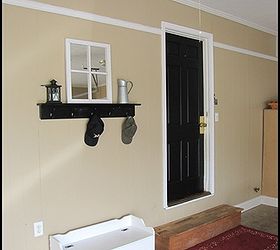 adding a mudroom to our garage, garages, home improvement, laundry rooms, This is the before picture of our garage The black door led into our kitchen We added this new mudroom laundry room from the door over to the right wall of the garage