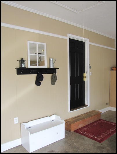 adding a mudroom to our garage, garages, home improvement, laundry rooms, This is the before picture of our garage The black door led into our kitchen We added this new mudroom laundry room from the door over to the right wall of the garage