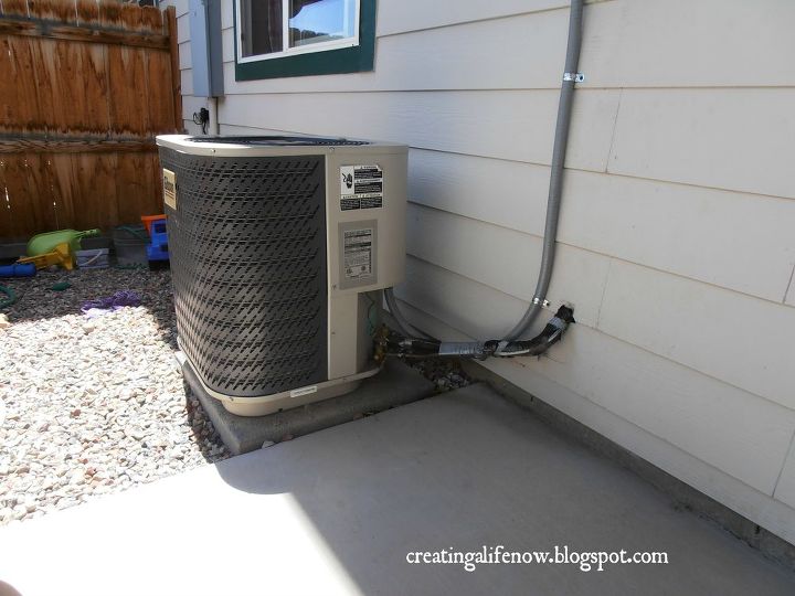 no money diy air conditioner screen, diy, how to, outdoor living, On our small patio area this a c unit was a huge eyesore