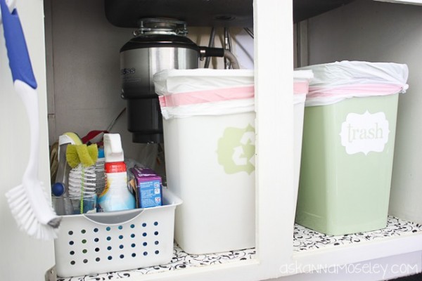 under the kitchen sink organization, organizing, Everything fits perfectly and is easy to access despite the huge garbage disposal right in the middle of the cabinet