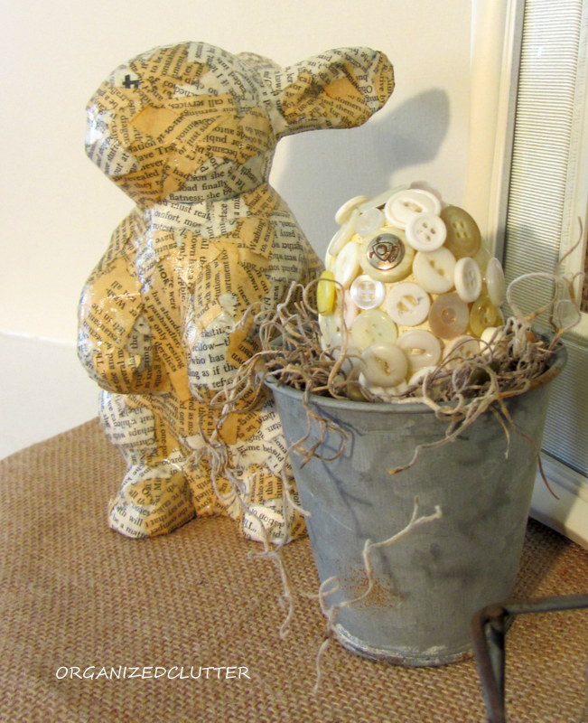 a book page easter bunny, crafts, decoupage, The next morning some of the blue showed through in a few spots so I added a few more pieces of paper Here he is with one of my button eggs