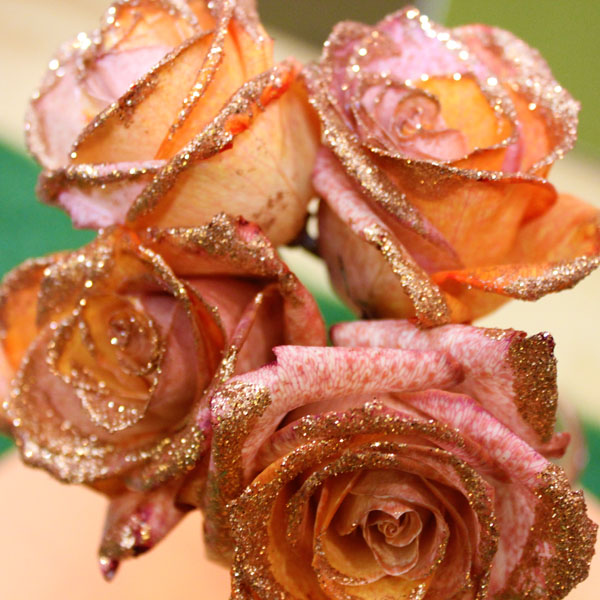 rainbow and glitter roses for the holidays, christmas decorations, crafts, seasonal holiday decor, These roses were dyed orange and purple and dipped in gold glitter perfect for fall and Thanksgiving celebrations