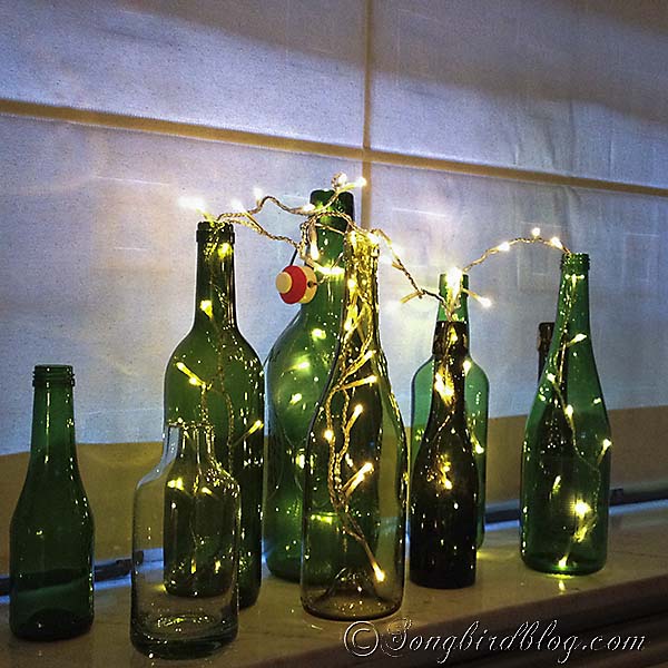 green bottles window sill, fireplaces mantels, home decor, seasonal holiday decor