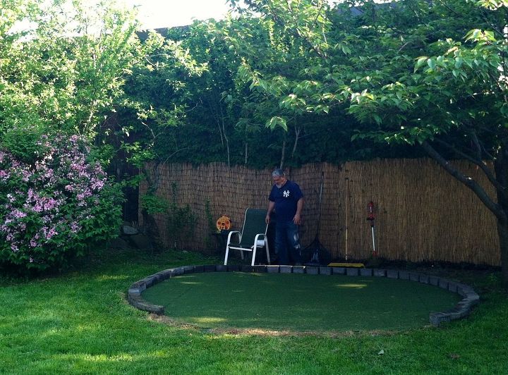 diy backyard golf green my dad s gift to himself for father s day, Here s my Dad Chris finishing up his green