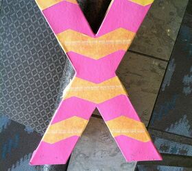 3 d valentine s day letters, crafts, seasonal holiday decor, valentines day ideas, I spray painted my letters pink After they dried I used different types of Frog Tape to tape off different designs I used Frog Tape Shape Tape for chevron stripes on this X
