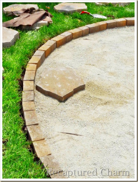 fire pit patio, outdoor living, patio, An edging stone was used to keep everything contained at grass level Plastic edging at garden area Fill in with more screening Tamper the limestone down water tamper again Best to let sit a couple of days