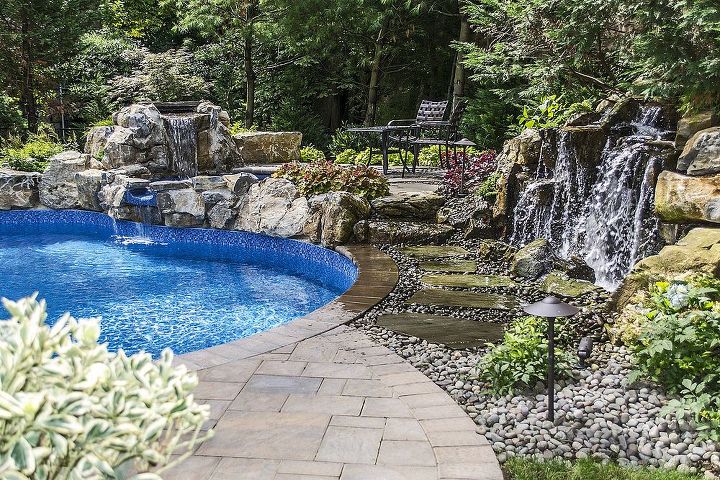 peaceful backyard how to solve outdoor noise problems, decks, landscape, outdoor living, ponds water features, pool designs, spas, Pondless Waterfall Pondless waterfall cascading over imported moss rock boulders beautifully eliminates noise