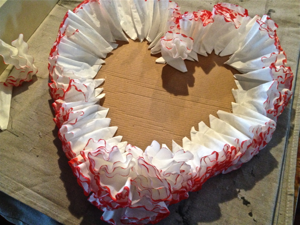 red coffee filter heart, crafts, repurposing upcycling, seasonal holiday decor, Glue around the edges first