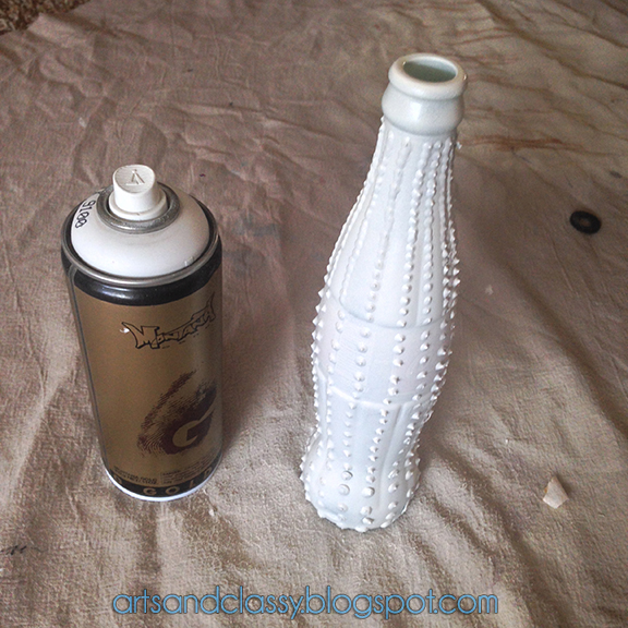 inexpensive easy diy project create porcelain and aged bronze vases, crafts, repurposing upcycling, Once you are happy with the height of your pattern you will begin to spray paint several layers on each vase to make sure its completely coated evenly and you will not see any puff paint colors showing through