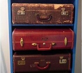 repurposed bookshelf, cleaning tips, storage ideas, with suitcases