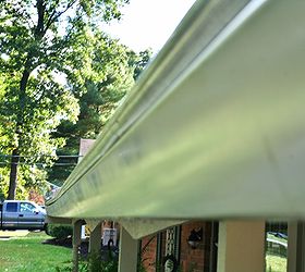 how to clean moldy gutters and bricks, cleaning tips, concrete masonry, curb appeal, Attach the cleaner to the hose and pass over the moldy places a couple of times Let sit for a few minutes and then scrub Repeat a couple of times