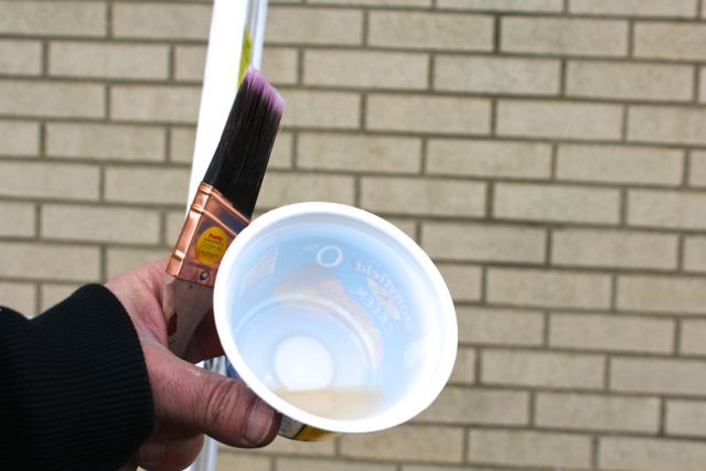 remove silicone caulk with an environmentally friendly product, curb appeal, home maintenance repairs, how to, Apply Lift Off with a painter s brush after squirting some of it into a yogurt cup